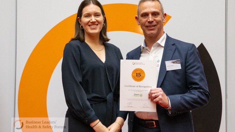 Minister for Workplace Relations and Safety, Hon Brooke van Velden, presents a recognition certificate to Peter Lord, Citycare Property's Chief Executive.